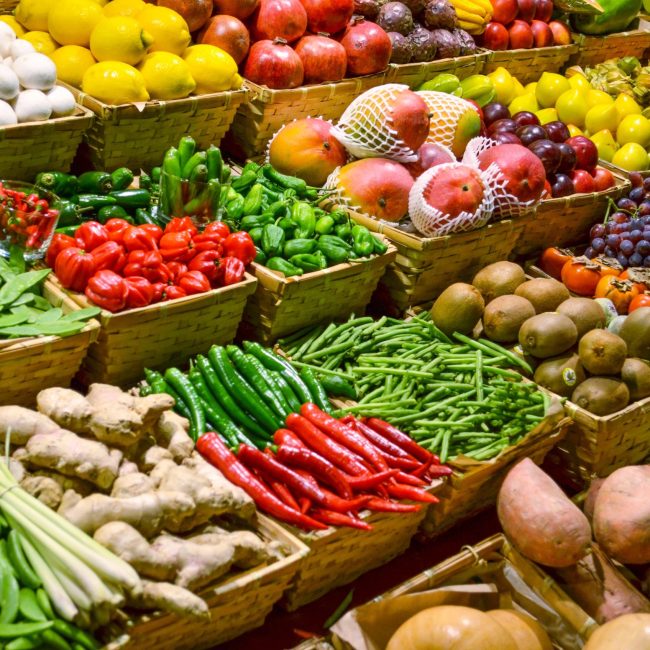 A market display of fresh fruits and vegetables